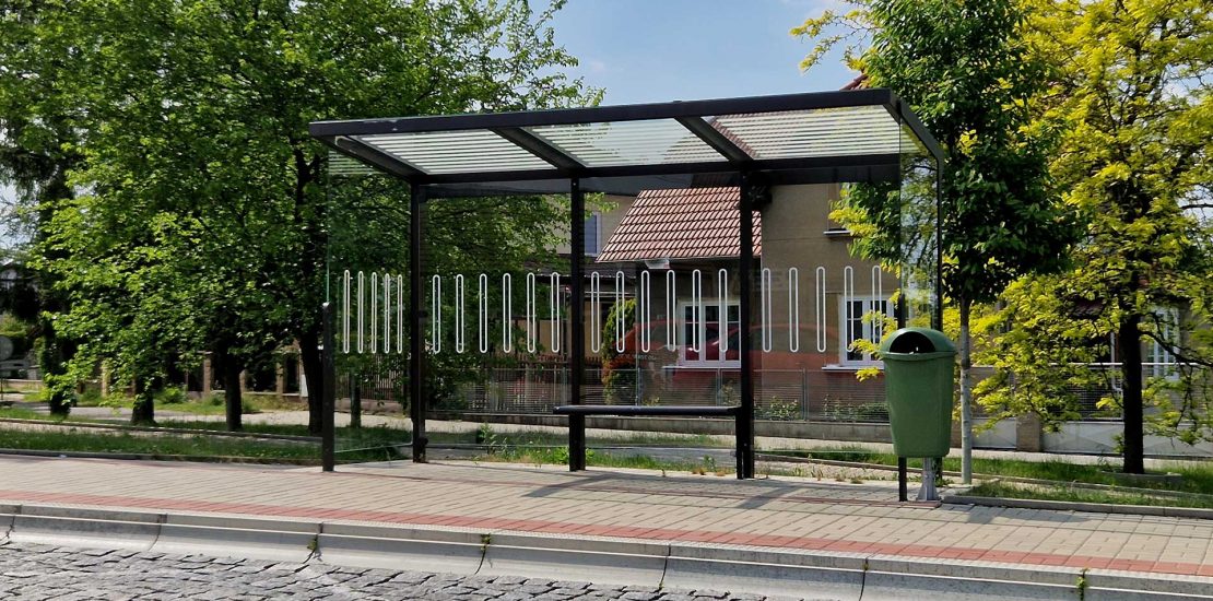 Bus shelter in covered walkway.