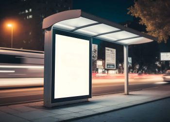 Bus Shelter with advertising at night time.