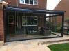 Sloped Retractable Roof Canopy with Glass Room Upgrade